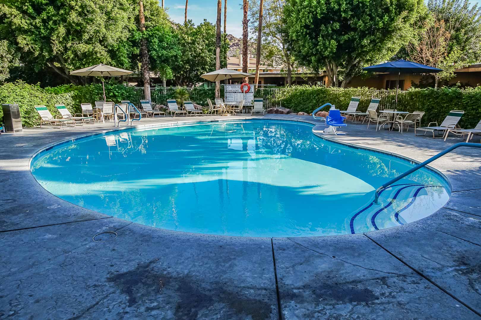 A peaceful outdoor swimming pool at VRI's Palm Springs Tennis Club in California.